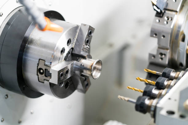 operator-machining-automotive-part-by-cnc-turning-machine